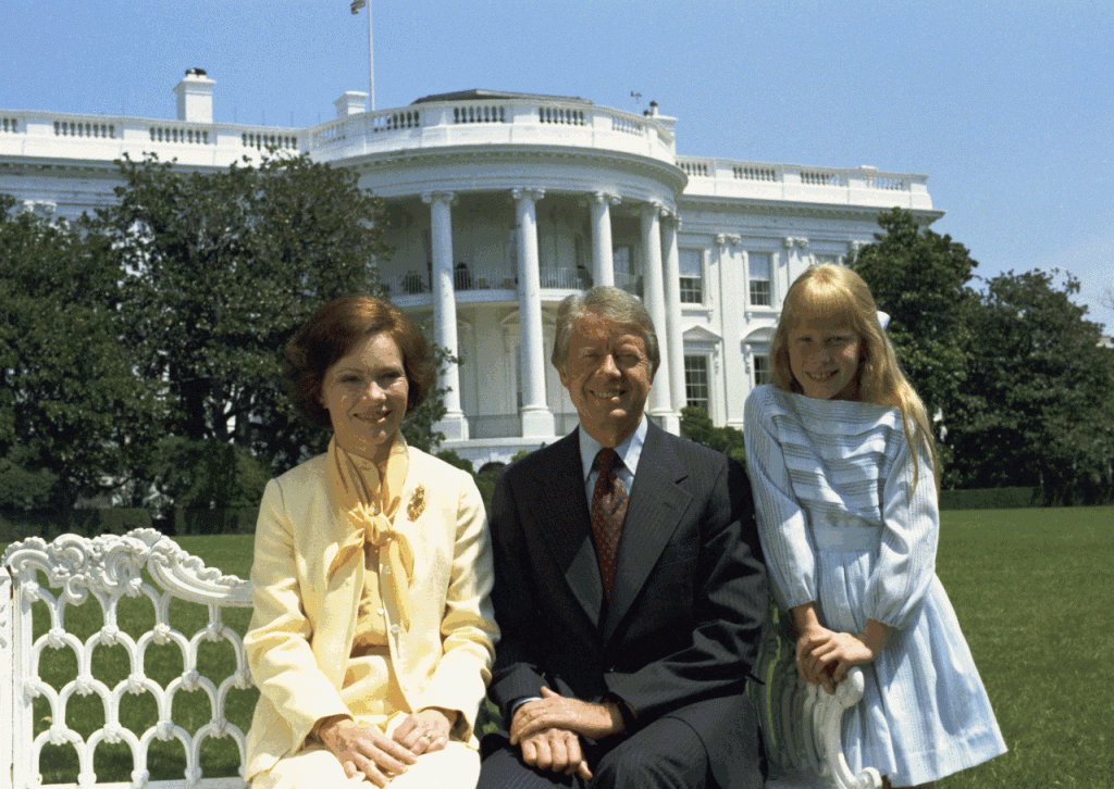 Amy, Rosaalynn, and Jimmy Carter in front of the White House in August of 1977.